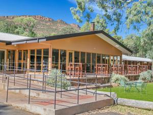 a building with a mountain in the background at Wilpena Pound Resort in Flinders Ranges