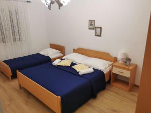 Postel nebo postele na pokoji v ubytování Apartment Toni - 150m from pebble beach