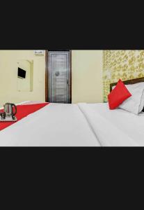 Ένα ή περισσότερα κρεβάτια σε δωμάτιο στο OYO Flagship 80976 The Star View Near Akshardham