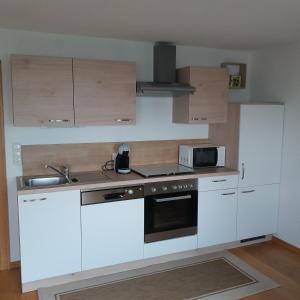 Kuchyň nebo kuchyňský kout v ubytování Schröckhof