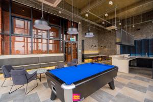 a billiard room with a pool table in it at Millerz Square Mana-Mana Suite in Kuala Lumpur
