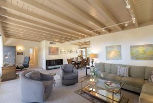 a living room with a couch and chairs and a table at 3891 Robert R Jones House home in Carmel