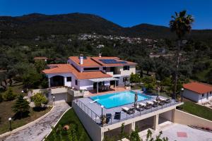 an aerial view of a house with a swimming pool at Kouvelia Country Home Luxury Villa Rental in Nerotriviá