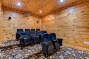 a room with blue chairs in a wooden wall at 518MTNVIEWLDGEACNCB - Mountain View Lodge in Gatlinburg