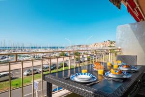 Balkón nebo terasa v ubytování La Grande Palmeraie - Spacieux studio avec vue mer, terrasse, port de Garavan