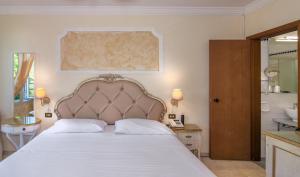Postel nebo postele na pokoji v ubytování Hotel Tahiti