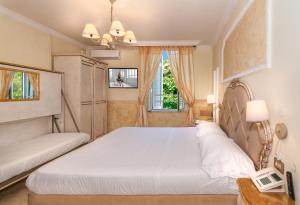 Postel nebo postele na pokoji v ubytování Hotel Tahiti
