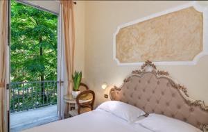 Postel nebo postele na pokoji v ubytování Hotel Tahiti
