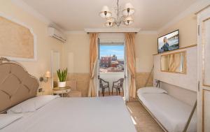 Postel nebo postele na pokoji v ubytování Hotel Tahiti