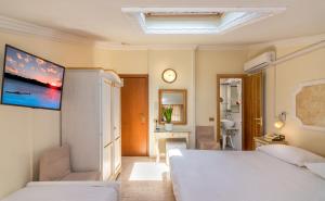 Postel nebo postele na pokoji v ubytování Hotel Tahiti