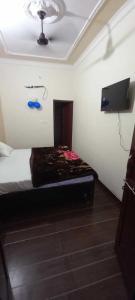 Katil atau katil-katil dalam bilik di OYO Hotel Paras Ratna