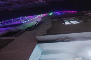 an overhead view of a street at night with lights at SPOT ON Pushpanjali Guest House in Patna