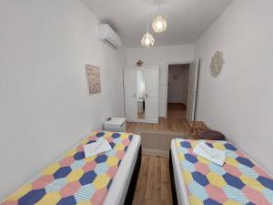 Posteľ alebo postele v izbe v ubytovaní Golden Beach apartments