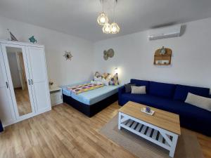 Posteľ alebo postele v izbe v ubytovaní Golden Beach apartments