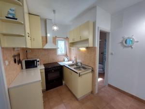 Kuchyňa alebo kuchynka v ubytovaní Golden Beach apartments