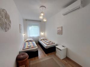 Posteľ alebo postele v izbe v ubytovaní Golden Beach apartments