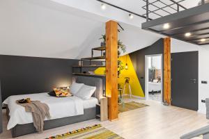 a bedroom with a bed with a wooden ladder at 6Rooms in Sibiu