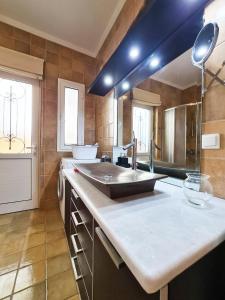 a kitchen with a sink and a counter top at Villa Victoria - 3 Bedroom Villa With a Private Pool in Katokhórion