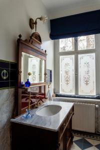 a bathroom with a sink and a mirror at Willa Świeradówka in Świeradów-Zdrój