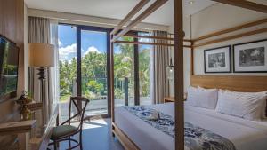 Postel nebo postele na pokoji v ubytování Plataran Ubud Hotel & Spa - CHSE Certified