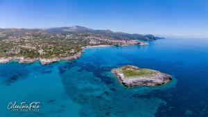 an aerial view of an island in the ocean at Residence La Punta in Marina di Camerota