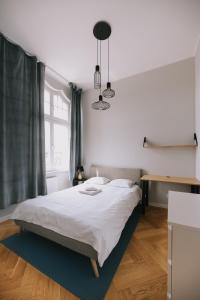 En eller flere senger på et rom på Apartament Słoneczny