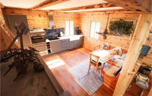 an overhead view of a kitchen and living room in a log cabin at Awesome Home In Mhldorf With Sauna in Mühldorf