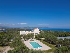 an aerial view of a villa with a swimming pool at Lyrids Apartments in Episkopí- Rethimno