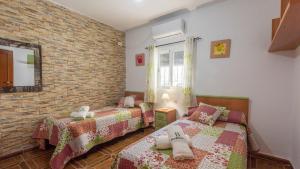 Postel nebo postele na pokoji v ubytování Casa Rural El Viso Rute by Ruralidays