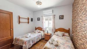 Postel nebo postele na pokoji v ubytování Casa Rural El Viso Rute by Ruralidays