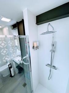 a bathroom with a shower and a toilet at CASA MI LOLA in Benidorm