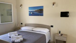 Postel nebo postele na pokoji v ubytování Is Arenas Biancas Agriturismo
