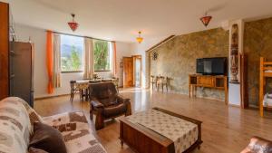 a living room with a couch and a table at Cortijo la Era Castril by Ruralidays in Castril