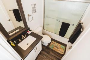 a bathroom with a toilet and a sink at Modern New Close to Downtown LA 1 Bedroom with Parking in Los Angeles