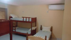 Ένα ή περισσότερα κρεβάτια σε δωμάτιο στο La Casa de Pedro Hostel