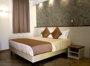 Llit o llits en una habitació de BHL Boutique Rooms Legnano