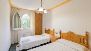 Łóżko lub łóżka w pokoju w obiekcie Villa Rural Paquete Pozo Alcón by Ruralidays
