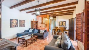 a living room with a couch and a table at Casa Azahar Jimena de la Frontera by Ruralidays in Jimena de la Frontera