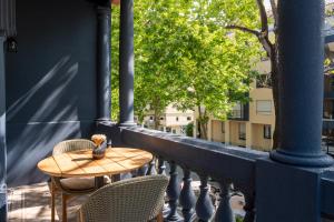 a table and two chairs on a balcony at Casa da Marechal - Boutique Hotel by Oporto Collection - Adults Only in Porto