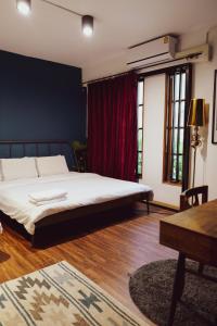 Postel nebo postele na pokoji v ubytování T-House BKK 2Floors near BTS with swimming pool and free Wifi