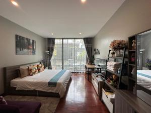 Ένα ή περισσότερα κρεβάτια σε δωμάτιο στο PomPom Home