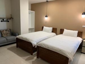 Voodi või voodid majutusasutuse 屏東潮州民宿-綠品文旅Green Inn toas
