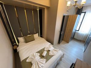 Postel nebo postele na pokoji v ubytování New Taksim Hotel