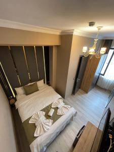 Postel nebo postele na pokoji v ubytování New Taksim Hotel