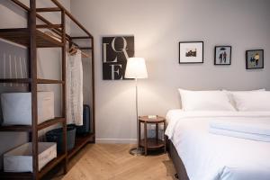 a bedroom with a bunk bed and a ladder at humble abode Bangkok Vacation Home in Bangkok