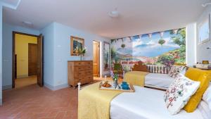 a bedroom with two beds and a painting on the wall at Casa Perano in Gaiole in Chianti