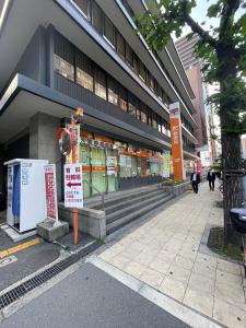 a store front of a building on a city street at マルチステイ大阪心斎橋 in Osaka