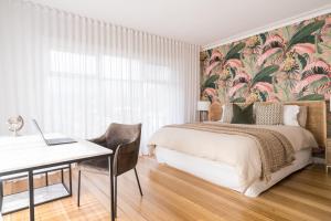Ένα ή περισσότερα κρεβάτια σε δωμάτιο στο Peninsula Luxury Beach House FREE WI-FI