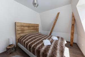 Posteľ alebo postele v izbe v ubytovaní COTE MONTAGNE