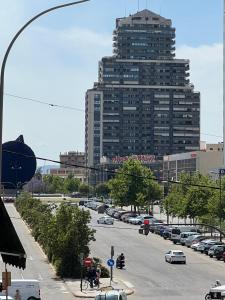 a city street with a large building in the background at Sweet Home in Valencia